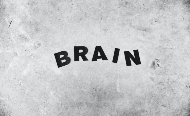 The word brain spelled out in black letters on a gray background. Retrain your brain with Neurofeedback for Anxiety in Washington, DC.