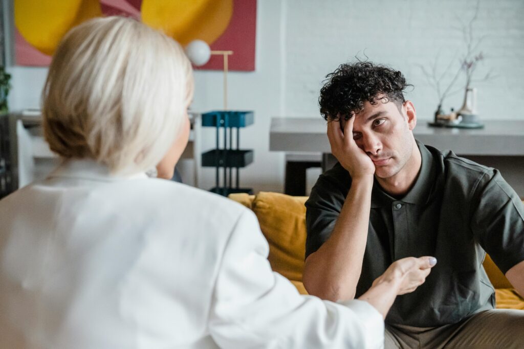 Man Looking at His Therapist with a frustrated look