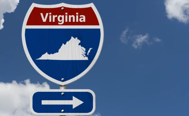 Virginia highway sign with state outline pointing direction, representing finding mental health services in Virginia