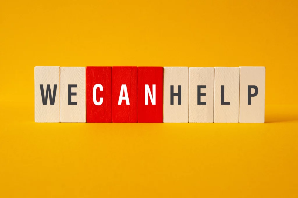 Wooden blocks spelling "WE CAN HELP" with emphasis on CAN, representing support for adults with ADHD seeking care after Chesapeake Center closure in Washington DC area