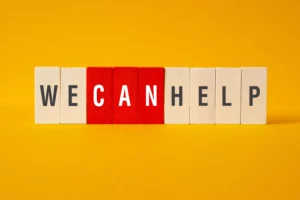 Wooden blocks spelling "WE CAN HELP" with emphasis on CAN, representing support for adults with ADHD seeking care after Chesapeake Center closure in Washington DC area