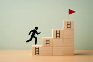A black figure running up steps representing goals